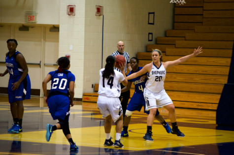 Kristen Nunn,  a freshman guard for the Shepherd University women's basketball team, takes a shot during the game against Chowen University. 