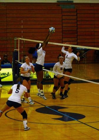 Christine Jackson, a middle hitter for the Shepherd University Rams volleyball team, makes a block during a recent home match.