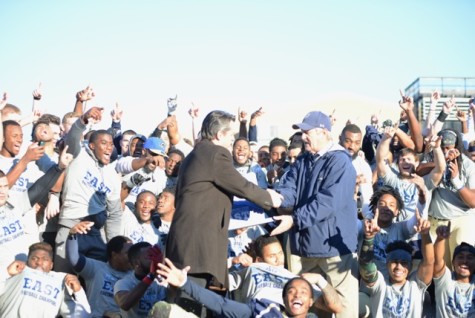 Mountain East Conference commissioner presents conference trophy to Shepherd University Football Coach, Monte Cater after Saturdays game. 