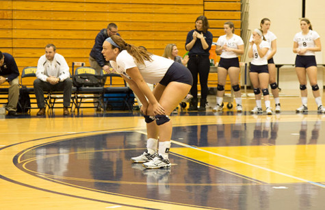 #13 Anna Roper patiently waits for the ball to come back over net. 
