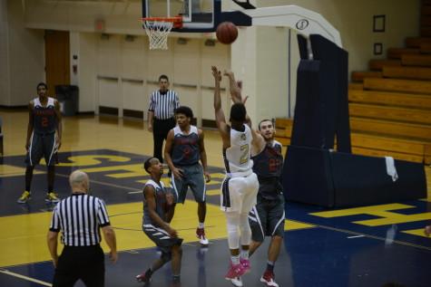 Steffen Davis, a Shepherd University men's basketball player, hits one of his record tying 10 three-pointer shots during the game against Davis and Elkins College.
