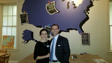 Candidate for West Virginia's 2nd Congressional District Cory Simpson (right) with his wife Dr. Meagan McGinley Simpson (left) standing in front a mural of the United States in at Domestic.