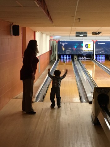 Learning Center Staff Paulette Lashley and child from the center celebrate a really good bowling frame.