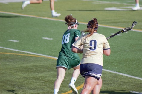 Alex Green sprinting down-field with the ball against Mercyhurst University 