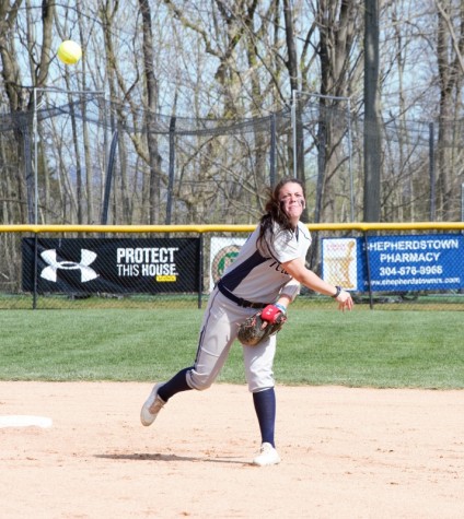 Rachel Taylor gunning the ball to first base for an out