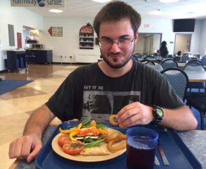 Shepherd University student, Colton Roberts, enjoys a meal in Shepherd's dining hall.