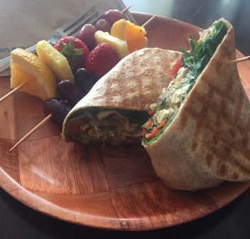 Pesto chicken wrap with a side of fruit from local cafe Mellow Moods.