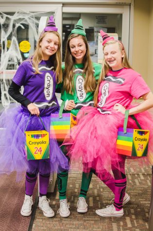Three friends coordinate their costumes and attend the event to participate in playing games and earning candy